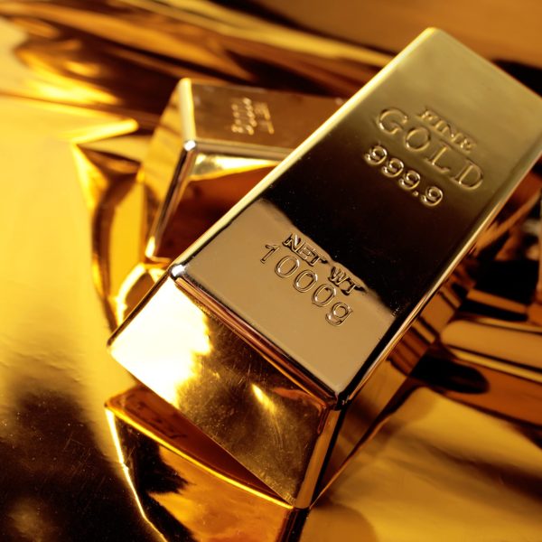 Two gold bars on a golden background